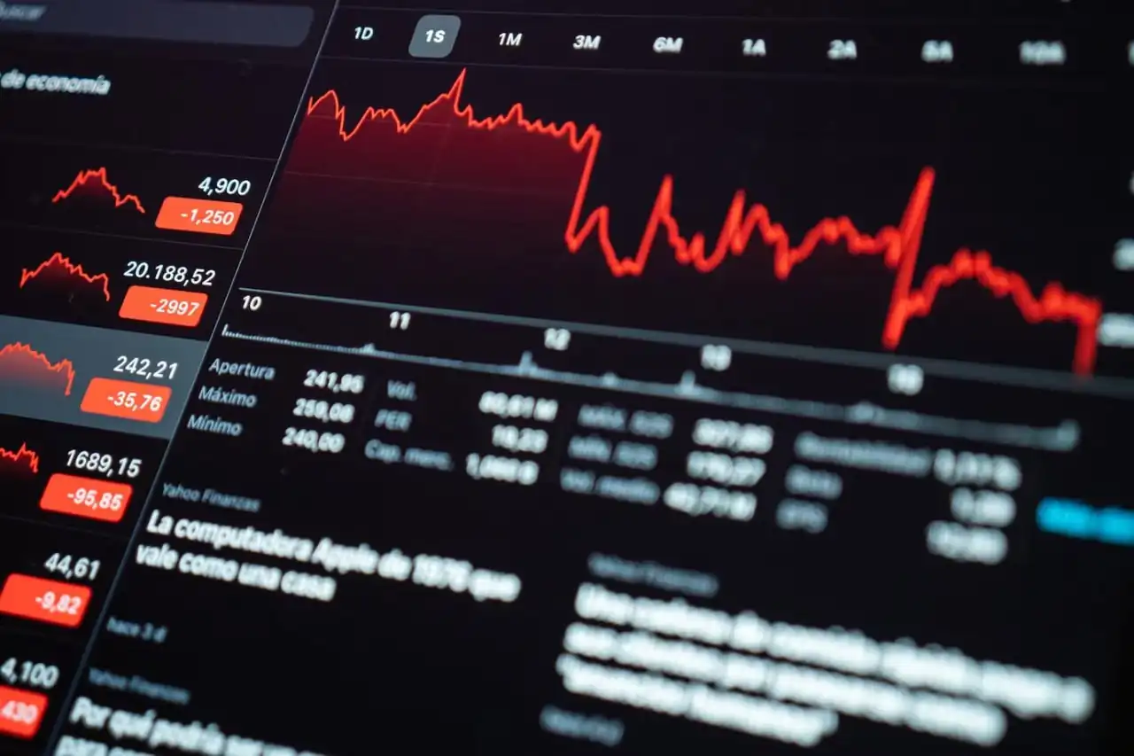 article about the cheapest cryptocurrency. Image shows 2 Bitcoins on white and red background